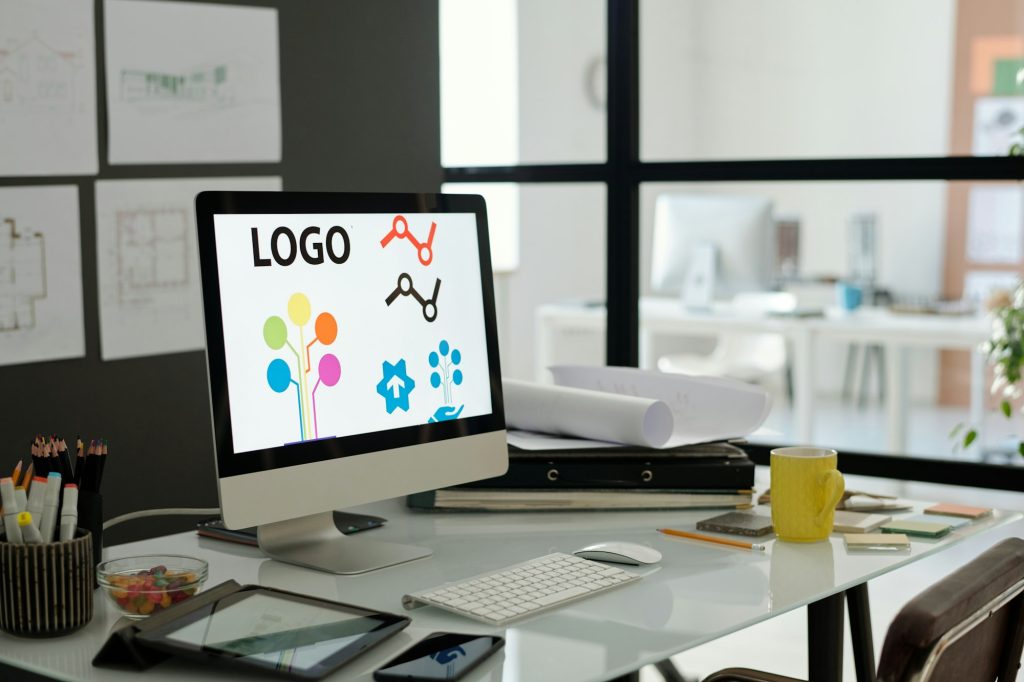 Workplace of webdesigner with computer monitor standing on desk